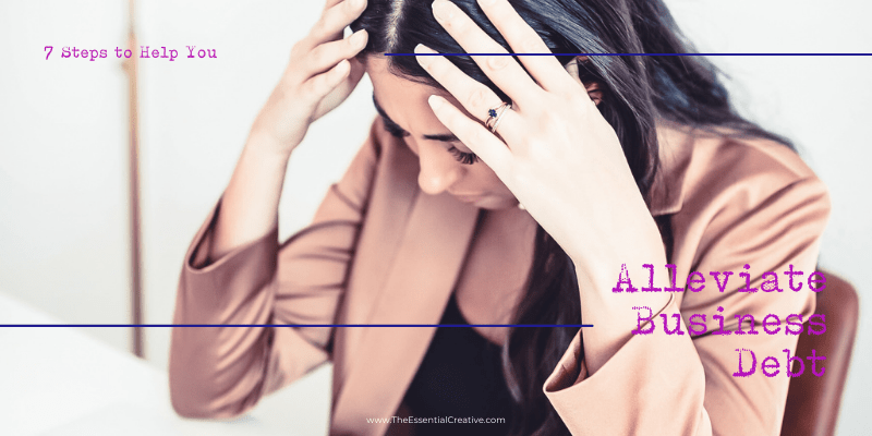 Woman who is frustrated and has her hands on her temples.