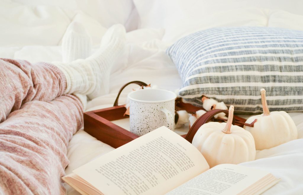 Picture of a book on a bed. 